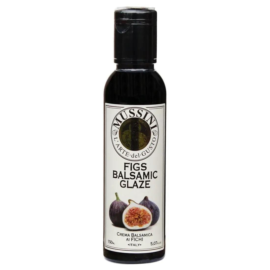 Bottle of Mussini fig balsamic glaze, perfect for drizzling over autumn salads.