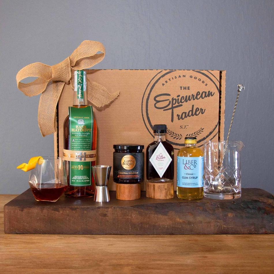 The Old Fashioned Kit with ingredients and glassware, perfect for crafting cocktails at home.